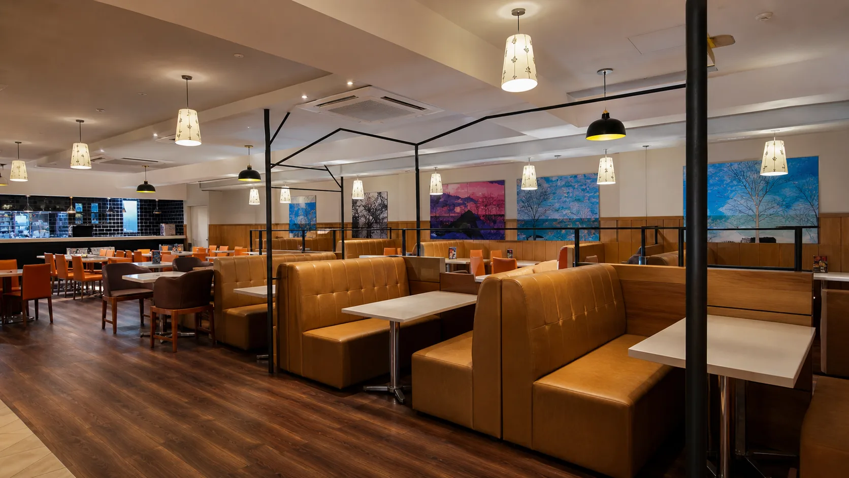 Hotel 7 refined restaurant interior with booth seating and warm lighting