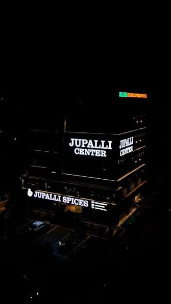 Hotel Jupalli Spices illuminated night signage