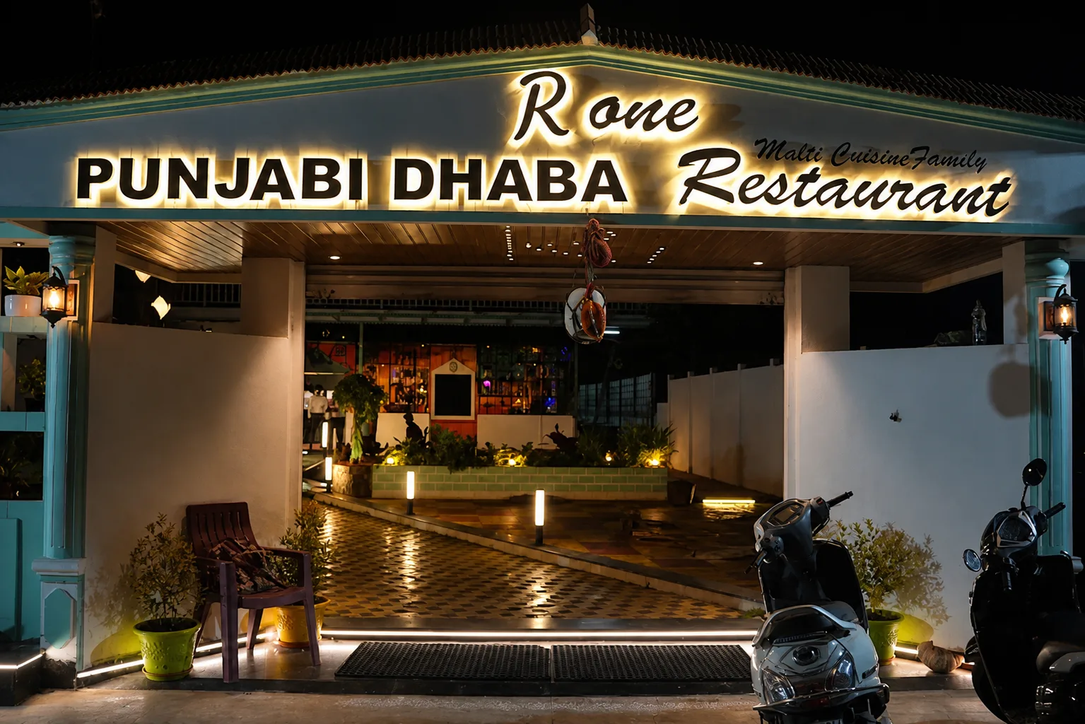 R One Punjabi Dhaba illuminated entrance at night